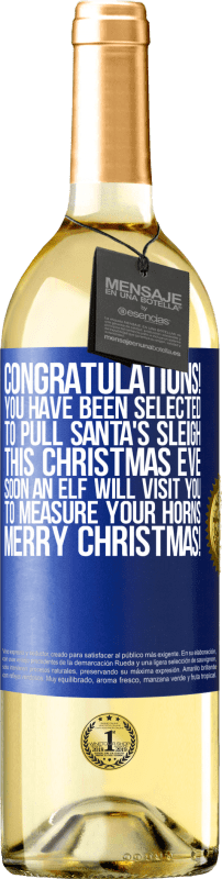 29,95 € 送料無料 | 白ワイン WHITEエディション おめでとうございます！あなたはこのクリスマスイブにサンタさんのそりを引くように選ばれました。すぐにエルフがあなたを訪ねて角を測定します。メリークリスマス！ 青いタグ. カスタマイズ可能なラベル 若いワイン 収穫 2023 Verdejo