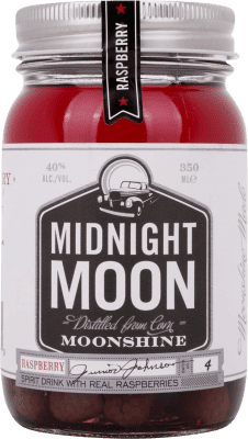 18,95 € Envío gratis | Licores Midnight Moon Moonshine Raspberry Estados Unidos Botellín Tercio 35 cl