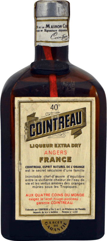 28,95 € 免费送货 | 利口酒 Cointreau Etiqueta Aux Quatre Coins 西班牙 75 cl 收藏品 不可食用 Orange — 橙子